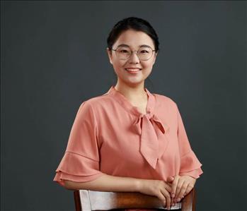 photo of a woman in front of black background